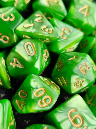 A pile of green dice with gold numbers